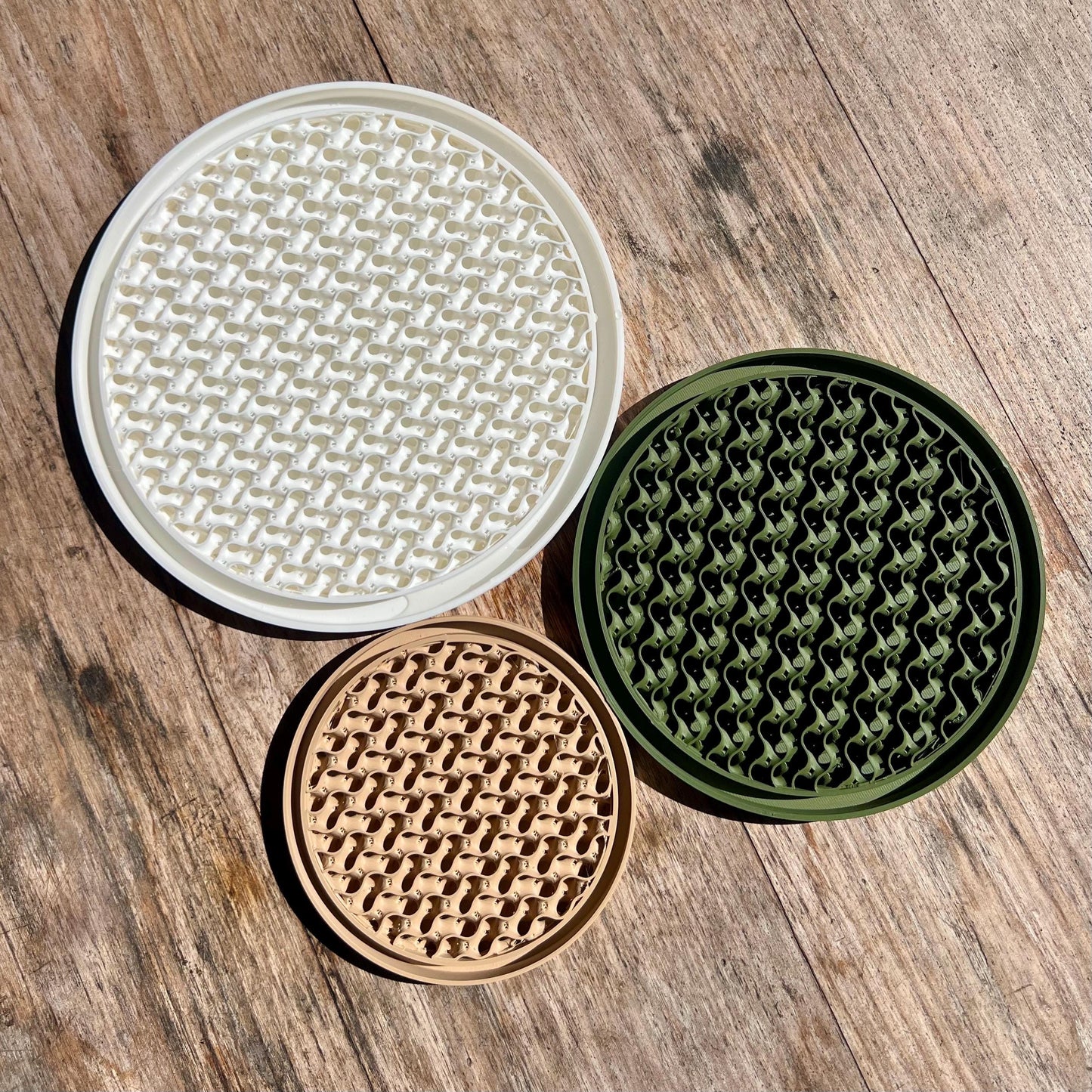 Gyroid drip trays shown in multiple colours, demonstrating available finish options